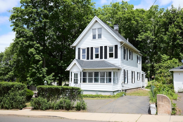 314 Skiff St, North Haven, CT 06473 - view of front of home with a chimney and a shingled roof