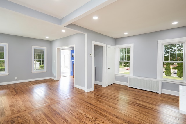 314 Skiff St, North Haven, CT 06473 - empty room featuring radiator heating unit, wood finished floors, baseboards, and recessed lighting