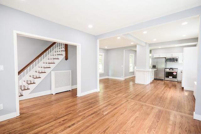314 Skiff St, North Haven, CT 06473 - unfurnished living room with stairs, light wood-type flooring, recessed lighting, and baseboards