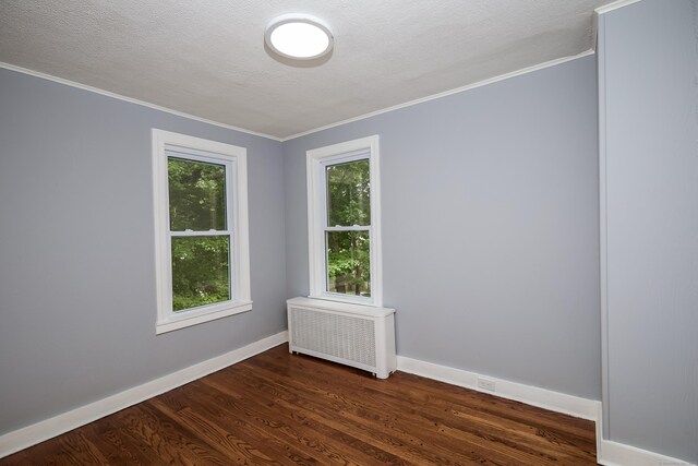 314 Skiff St, North Haven, CT 06473 - spare room featuring radiator heating unit, ornamental molding, dark wood finished floors, baseboards, and a textured ceiling