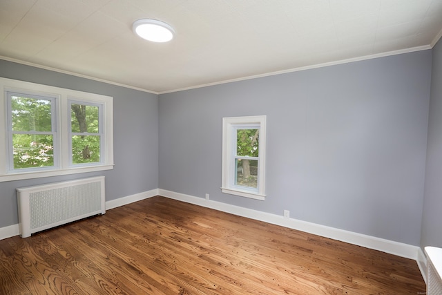 314 Skiff St, North Haven, CT 06473 - spare room featuring radiator, crown molding, baseboards, and dark wood-type flooring