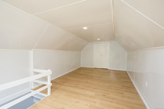 314 Skiff St, North Haven, CT 06473 - additional living space with light wood-type flooring, vaulted ceiling, and baseboards