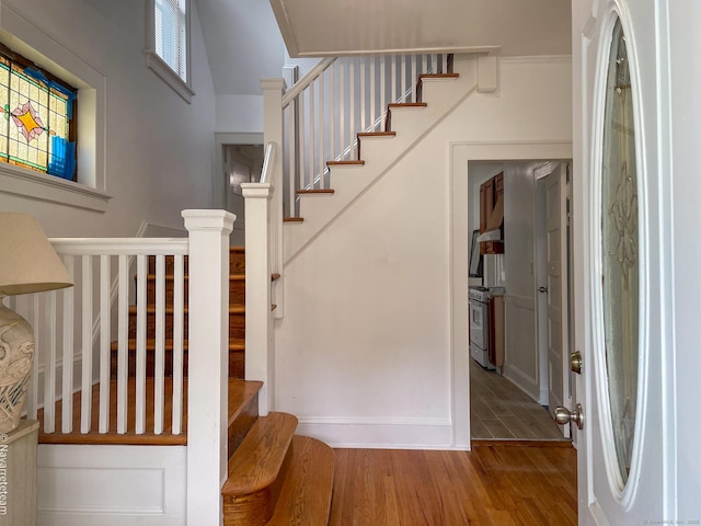 26 Stoehrs Pl, Bridgeport, CT 06606 - foyer with wood finished floors, stairs, and baseboards