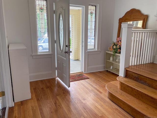 26 Stoehrs Pl, Bridgeport, CT 06606 - entrance foyer featuring baseboards, light wood finished floors, and stairs