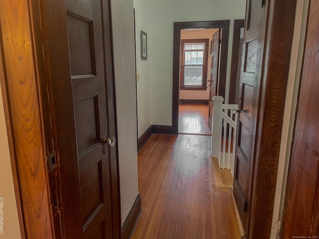 26 Stoehrs Pl, Bridgeport, CT 06606 - corridor with hardwood / wood-style flooring, an upstairs landing, and baseboards