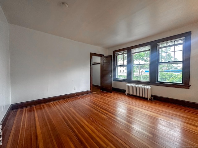 26 Stoehrs Pl, Bridgeport, CT 06606 - empty room with radiator, hardwood / wood-style flooring, and baseboards