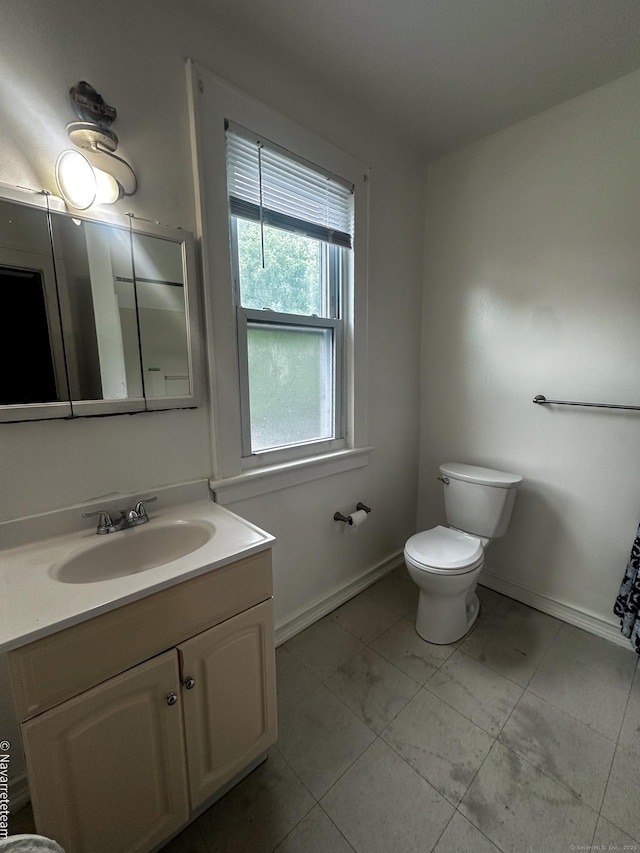 26 Stoehrs Pl, Bridgeport, CT 06606 - bathroom with vanity, toilet, and baseboards
