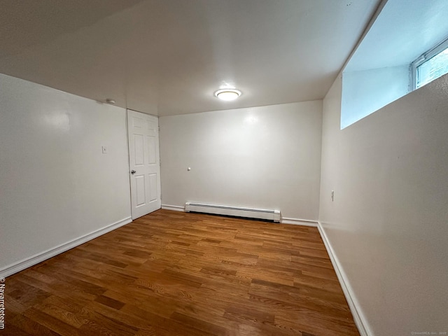 26 Stoehrs Pl, Bridgeport, CT 06606 - unfurnished room featuring baseboard heating, baseboards, and wood finished floors