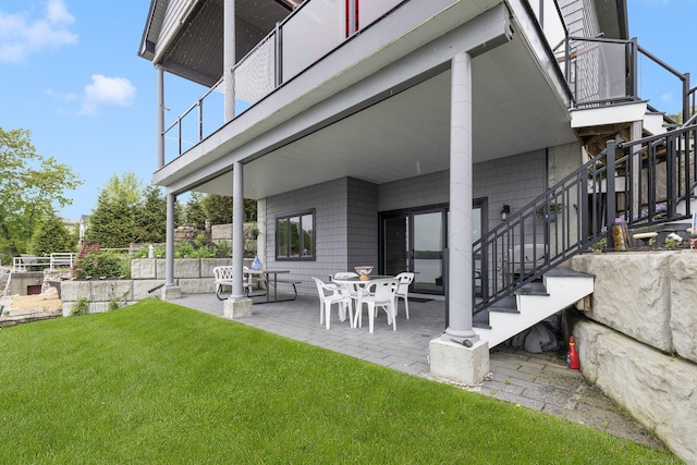 194 Killdeer Rd, Webster, MA 01570 - view of grassy yard with stairway, a patio area, and a balcony