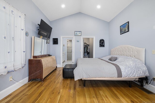 194 Killdeer Rd, Webster, MA 01570 - bedroom with light wood finished floors, a closet, a spacious closet, baseboards, and vaulted ceiling