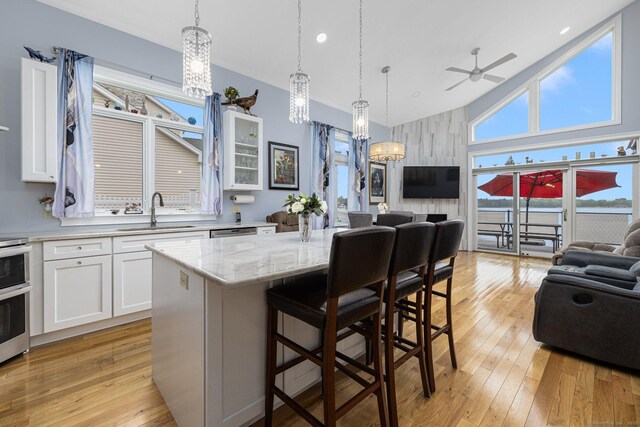 194 Killdeer Rd, Webster, MA 01570 - kitchen with a sink, open floor plan, a chandelier, ceiling fan, and high vaulted ceiling