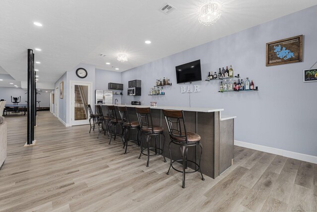 194 Killdeer Rd, Webster, MA 01570 - indoor bar featuring stainless steel appliances, light wood finished floors, baseboards, and recessed lighting