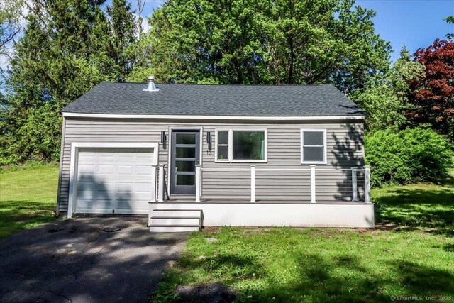 13 Turner Rd, Litchfield, CT 06778 - view of front facade featuring an attached garage, a front yard, roof with shingles, and asphalt driveway