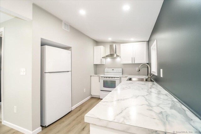 13 Turner Rd, Litchfield, CT 06778 - kitchen with white appliances, a sink, wall chimney exhaust hood, white cabinets, and light stone countertops