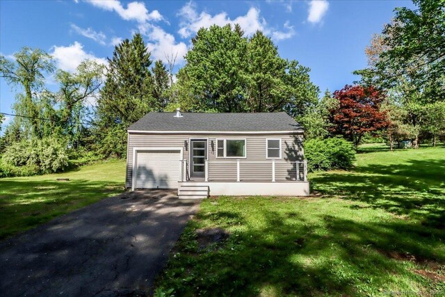 13 Turner Rd, Litchfield, CT 06778 - single story home featuring a garage, asphalt driveway, and a front lawn