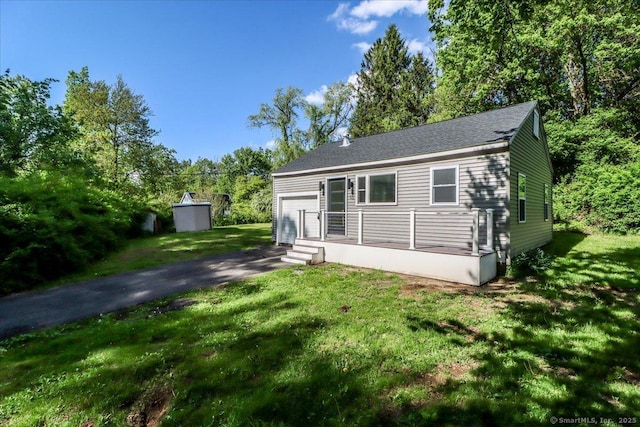 13 Turner Rd, Litchfield, CT 06778 - view of front of house with a front lawn, an attached garage, and asphalt driveway