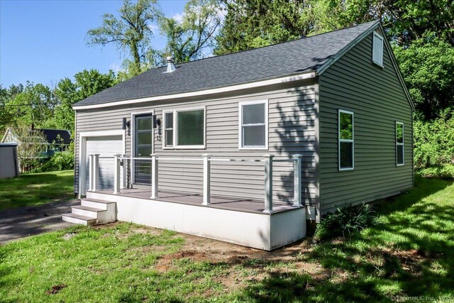 13 Turner Rd, Litchfield, CT 06778 - view of side of property featuring a lawn, roof with shingles, and a deck
