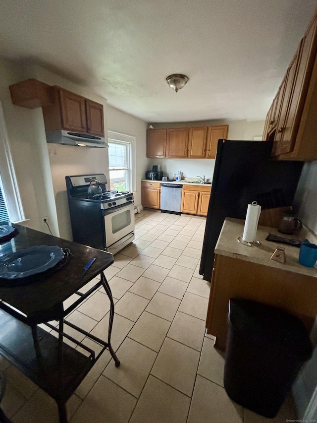 479 Broad St, Hartford, CT 06106 - kitchen featuring appliances with stainless steel finishes, range hood, brown cabinets, and light tile patterned flooring
