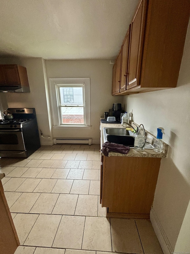 479 Broad St, Hartford, CT 06106 - kitchen featuring stainless steel gas stove, extractor fan, a baseboard radiator, a sink, and brown cabinetry