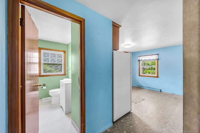 1 Pine Grove Ave, Enfield, CT 06082 - hall with a baseboard radiator and washer / clothes dryer