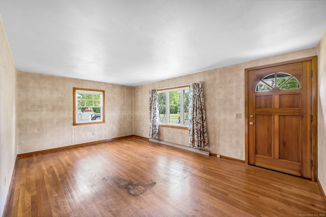 1 Pine Grove Ave, Enfield, CT 06082 - foyer with baseboard heating, wood finished floors, and plenty of natural light