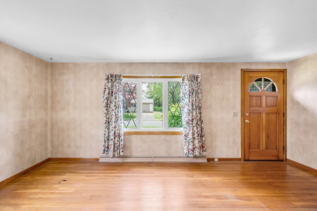 1 Pine Grove Ave, Enfield, CT 06082 - entryway featuring wood finished floors, baseboards, and a baseboard heating unit