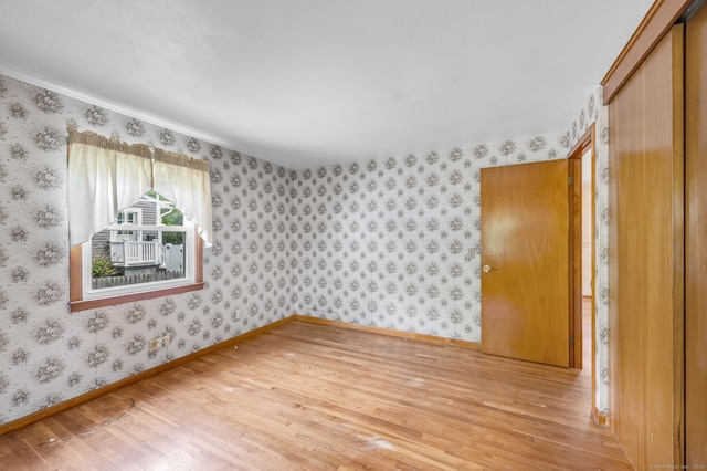 1 Pine Grove Ave, Enfield, CT 06082 - spare room featuring light wood finished floors, wallpapered walls, and baseboards