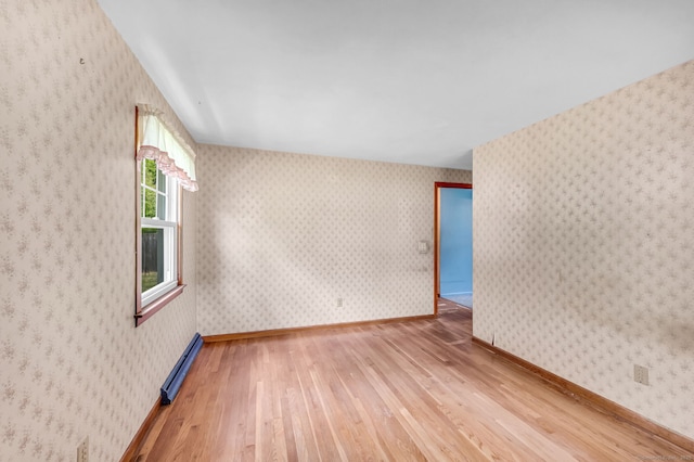 1 Pine Grove Ave, Enfield, CT 06082 - unfurnished room featuring wood-type flooring and a baseboard heating unit