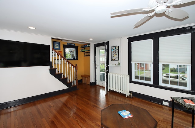 62 Mather St, Manchester, CT 06042 - living room with radiator heating unit, stairs, a ceiling fan, wood finished floors, and crown molding