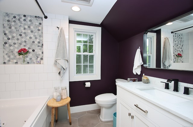 62 Mather St, Manchester, CT 06042 - full bath with tile patterned floors, a whirlpool tub, toilet, lofted ceiling, and vanity