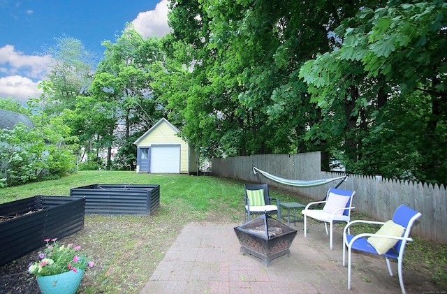 62 Mather St, Manchester, CT 06042 - view of yard featuring a garden, a patio, and an outdoor fire pit