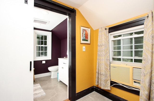 62 Mather St, Manchester, CT 06042 - bathroom featuring lofted ceiling, baseboards, toilet, cooling unit, and tile patterned flooring