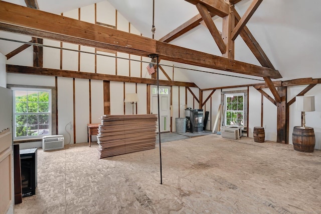29 Walnut St, Winchester, CT 06098 - unfurnished living room featuring high vaulted ceiling and a wall mounted air conditioner