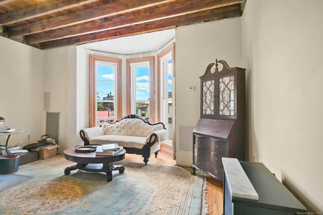 29 Walnut St, Winchester, CT 06098 - living area with wood finished floors and wooden ceiling with exposed beams