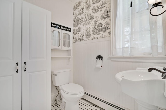 29 Walnut St, Winchester, CT 06098 - half bath featuring wainscoting, a baseboard heating unit, toilet, wallpapered walls, and a sink