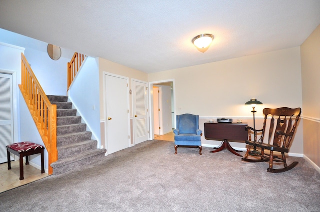 443 S Main St Unit 34, Manchester, CT 06040 - sitting room with stairway and carpet flooring