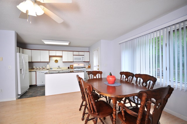 443 S Main St Unit 34, Manchester, CT 06040 - dining space featuring plenty of natural light, dark wood-style flooring, ceiling fan, baseboards, and a textured ceiling