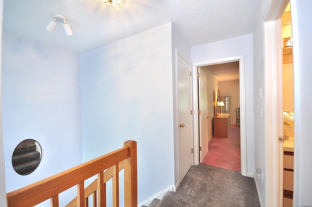 443 S Main St Unit 34, Manchester, CT 06040 - hallway with carpet flooring, an upstairs landing, and a textured ceiling