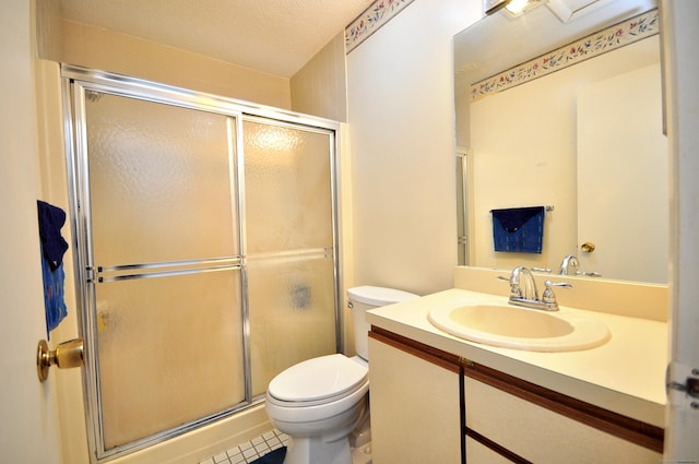 443 S Main St Unit 34, Manchester, CT 06040 - full bath featuring toilet, a shower with shower door, vanity, tile patterned floors, and a textured ceiling
