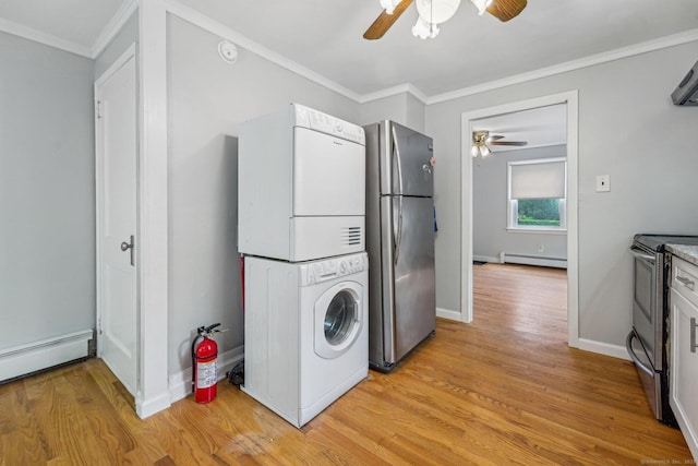 345 Hilliard St, Manchester, CT 06042 - laundry room with a ceiling fan, stacked washer / drying machine, baseboard heating, light wood-type flooring, and baseboards
