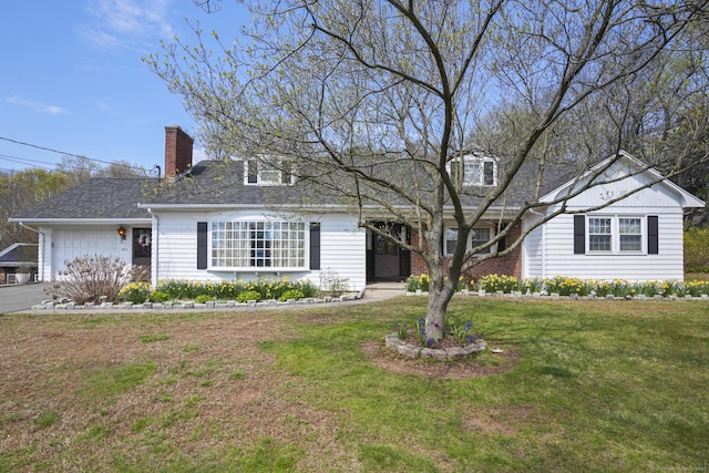 870 N Colony Rd, Meriden, CT 06450 - view of front facade with a chimney, a front lawn, an attached garage, asphalt driveway, and a shingled roof