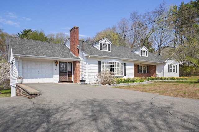 870 N Colony Rd, Meriden, CT 06450 - new england style home featuring asphalt driveway, an attached garage, a chimney, and a shingled roof