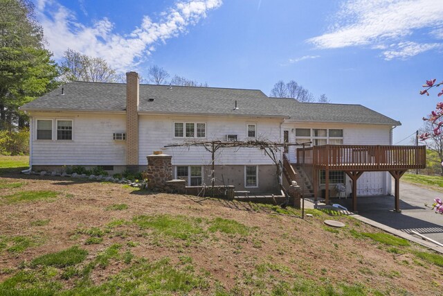 870 N Colony Rd, Meriden, CT 06450 - back of house featuring a wooden deck, a chimney, a carport, and roof with shingles