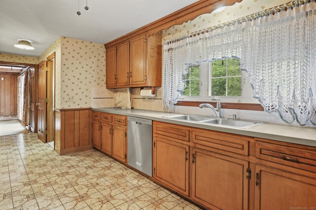870 N Colony Rd, Meriden, CT 06450 - kitchen with dishwasher, wallpapered walls, a sink, brown cabinets, and a baseboard radiator