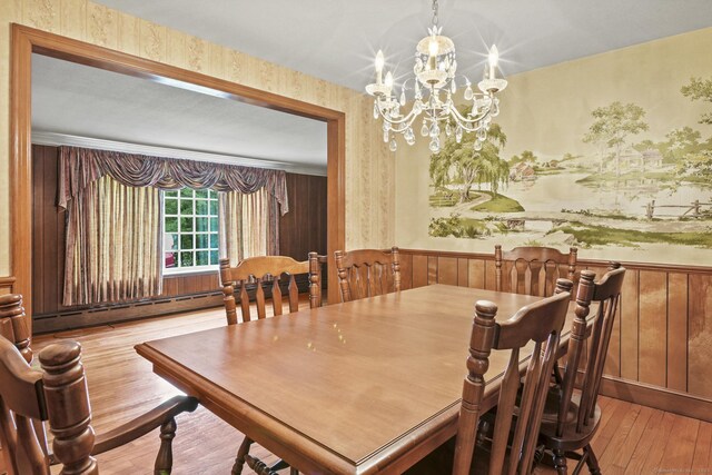 870 N Colony Rd, Meriden, CT 06450 - dining room featuring a wainscoted wall, a chandelier, wood-type flooring, a baseboard heating unit, and wallpapered walls