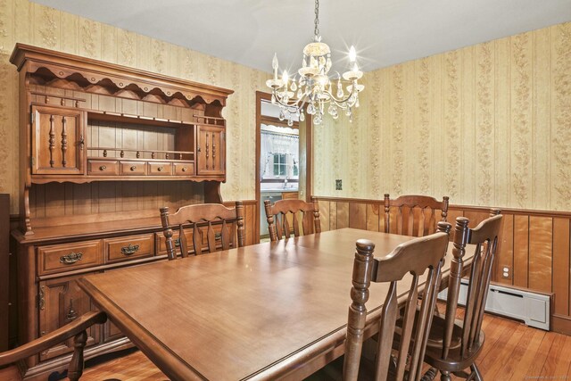 870 N Colony Rd, Meriden, CT 06450 - dining room with wallpapered walls, wood finished floors, a chandelier, a wainscoted wall, and a baseboard heating unit