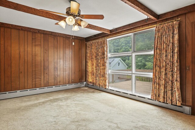 870 N Colony Rd, Meriden, CT 06450 - carpeted empty room with wood walls, beam ceiling, ceiling fan, and a baseboard heating unit
