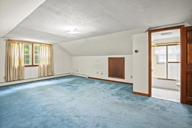 870 N Colony Rd, Meriden, CT 06450 - bonus room featuring carpet floors, baseboards, vaulted ceiling, a textured ceiling, and baseboard heating