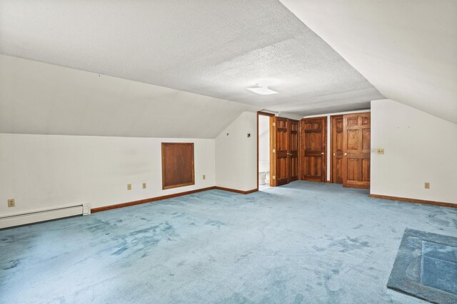 870 N Colony Rd, Meriden, CT 06450 - additional living space featuring lofted ceiling, baseboards, light carpet, a baseboard radiator, and a textured ceiling