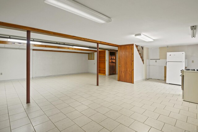 870 N Colony Rd, Meriden, CT 06450 - finished basement featuring freestanding refrigerator, stairs, and baseboards